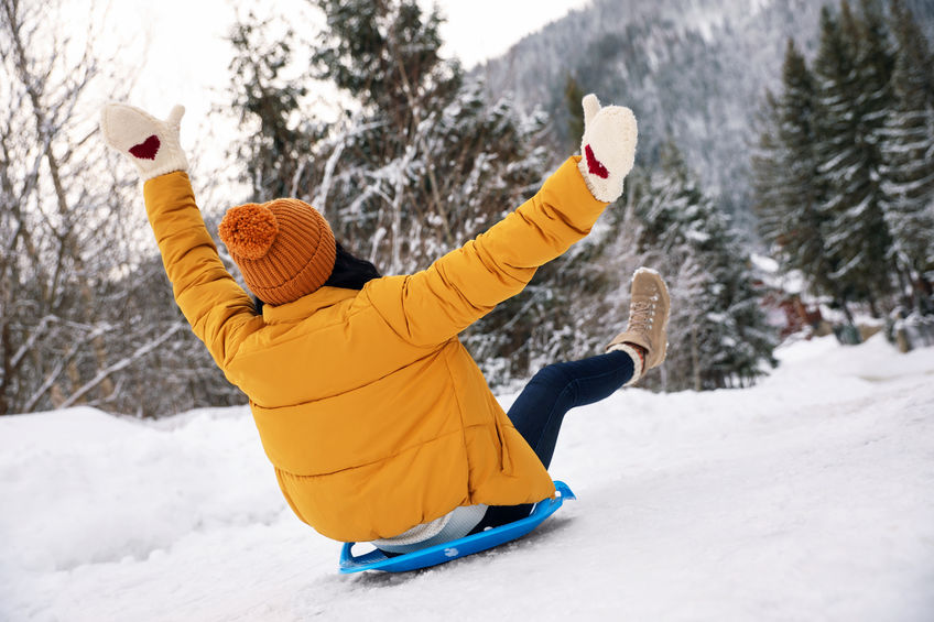 sledding in the snow