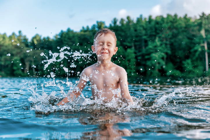 boy splashing in the water